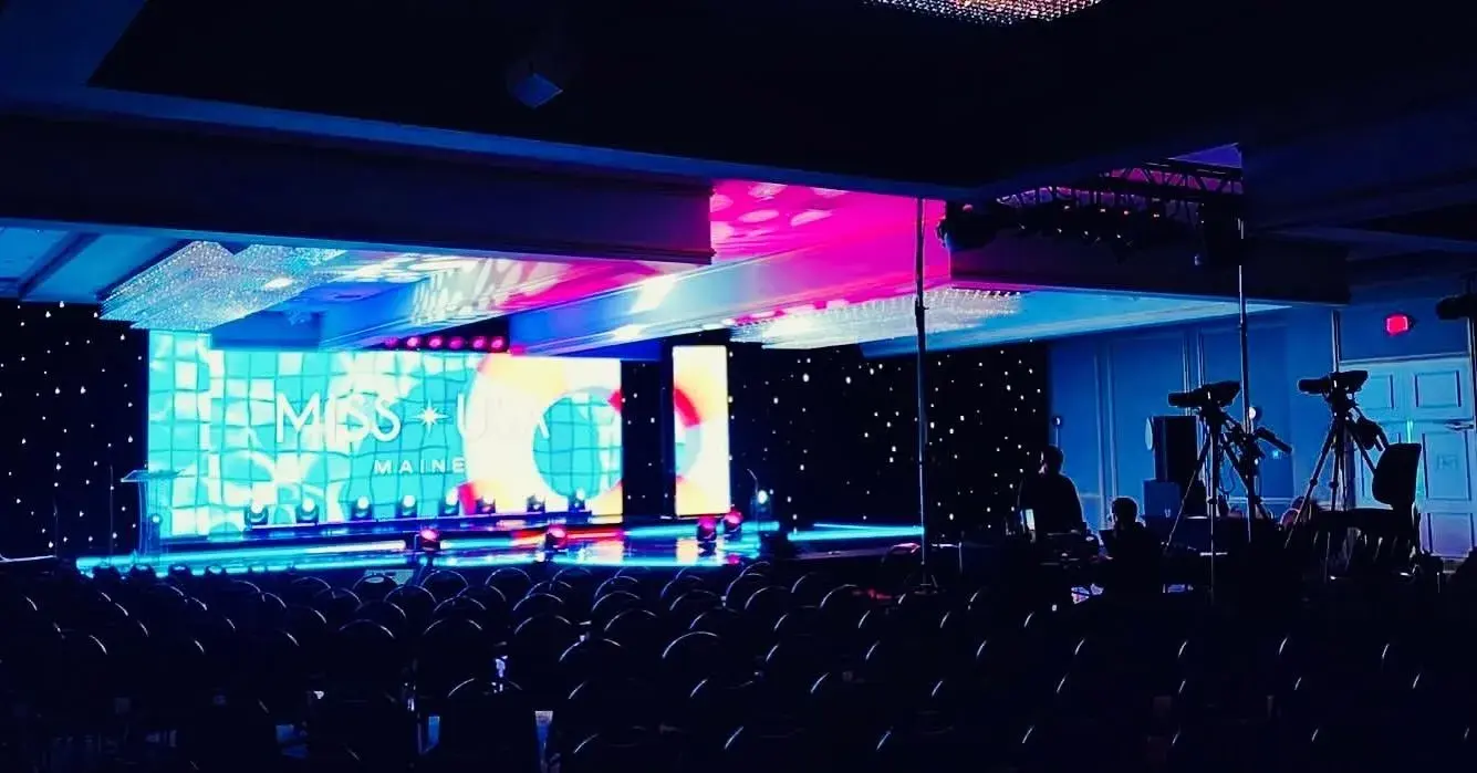 Wide stage with an HD video backdrop and camera platforms